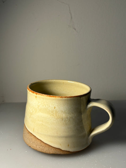 Ceramic mug with a brown base on a gray surface and background