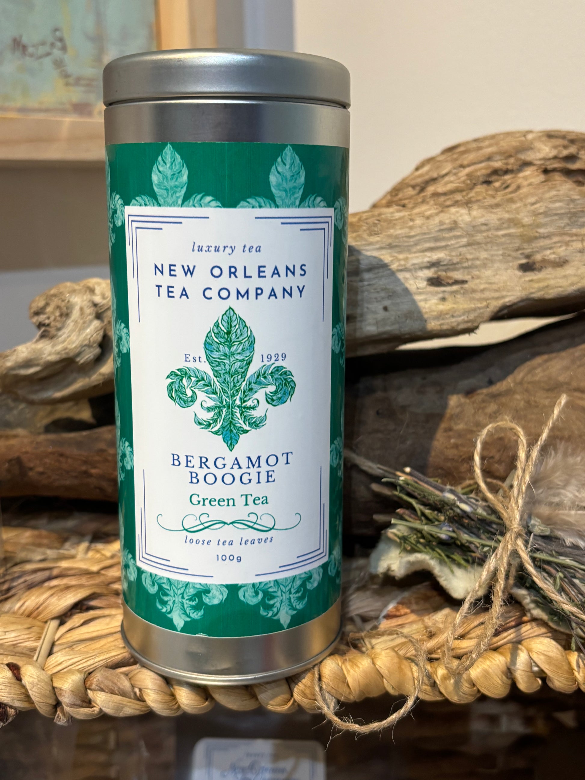 Tea canister with New Orleans Tea Company label on a rustic background