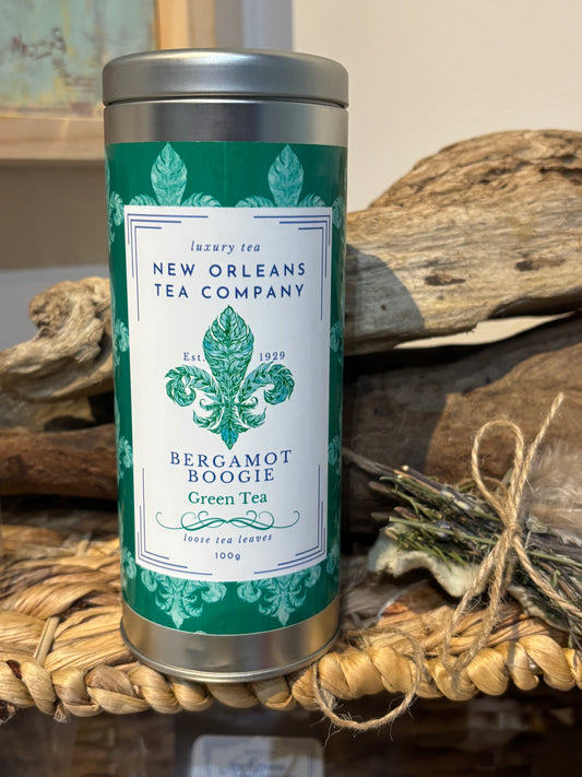 Tea canister with New Orleans Tea Company label on a rustic background